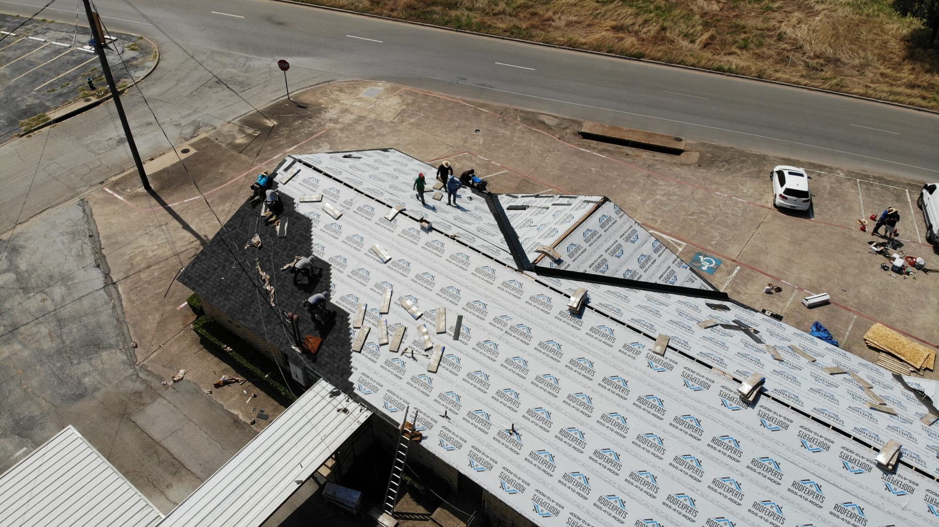 Metal roofing panels being installed