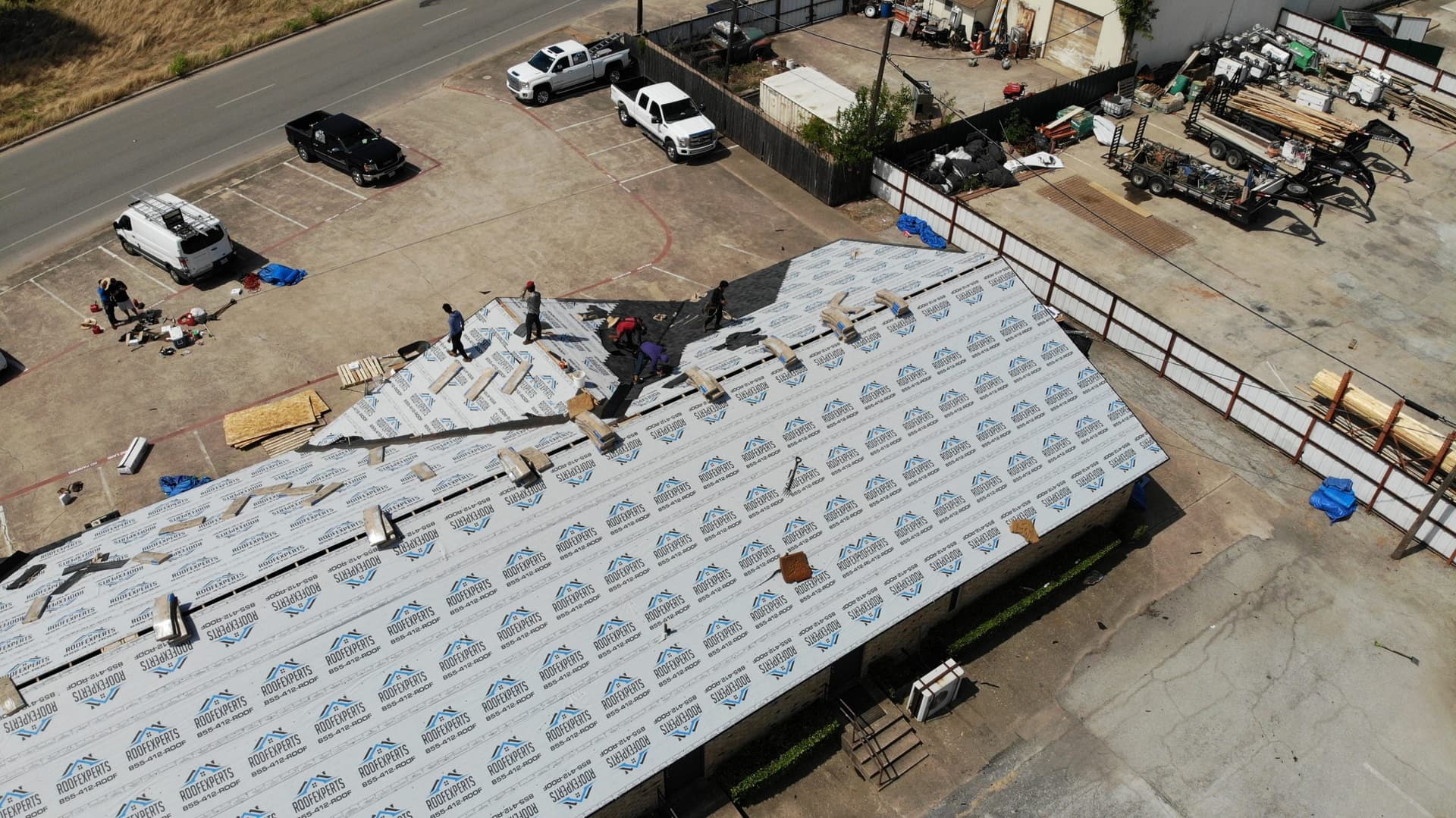 Long commercial roof section with underlayment fully dried in